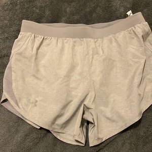 Under armor gray shorts. Heat gear for women. Helps keep you cool.